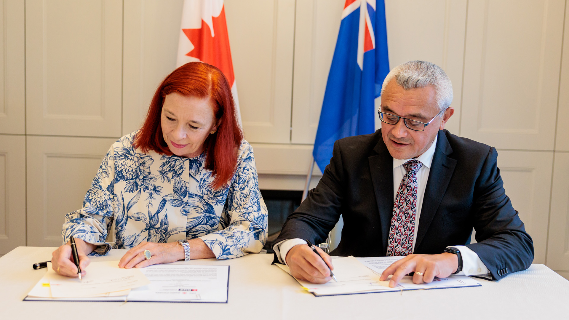 Catherine Tait and Jim Mather signing the agreement
